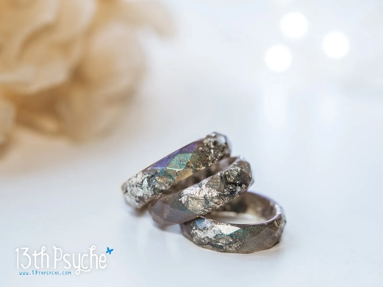 Iridescent grey faceted resin ring with silver flakes