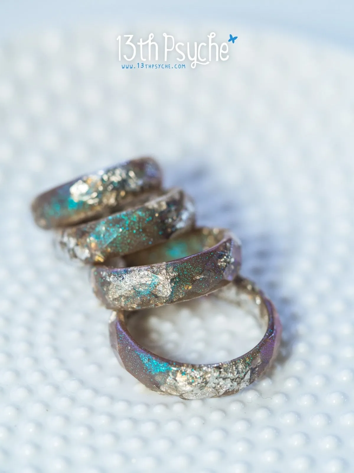 Iridescent grey faceted resin ring with silver flakes