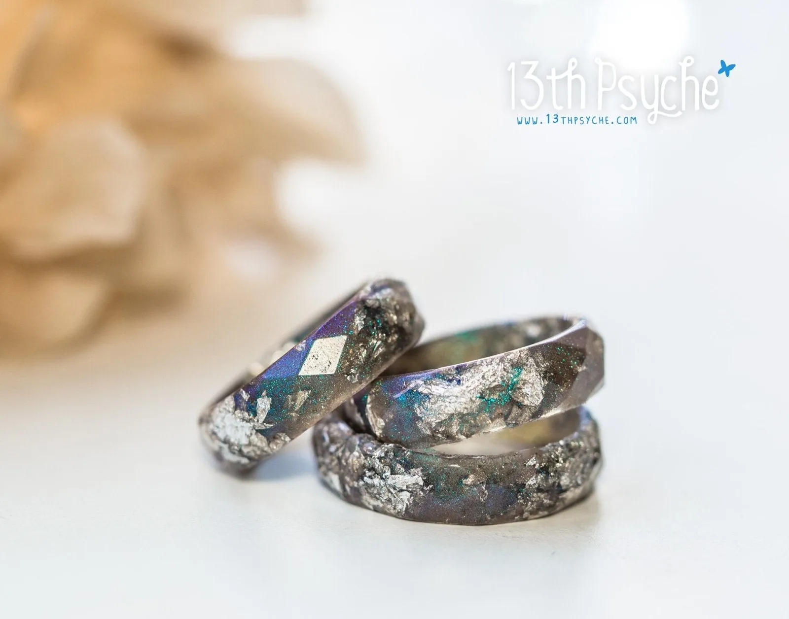 Iridescent grey faceted resin ring with silver flakes