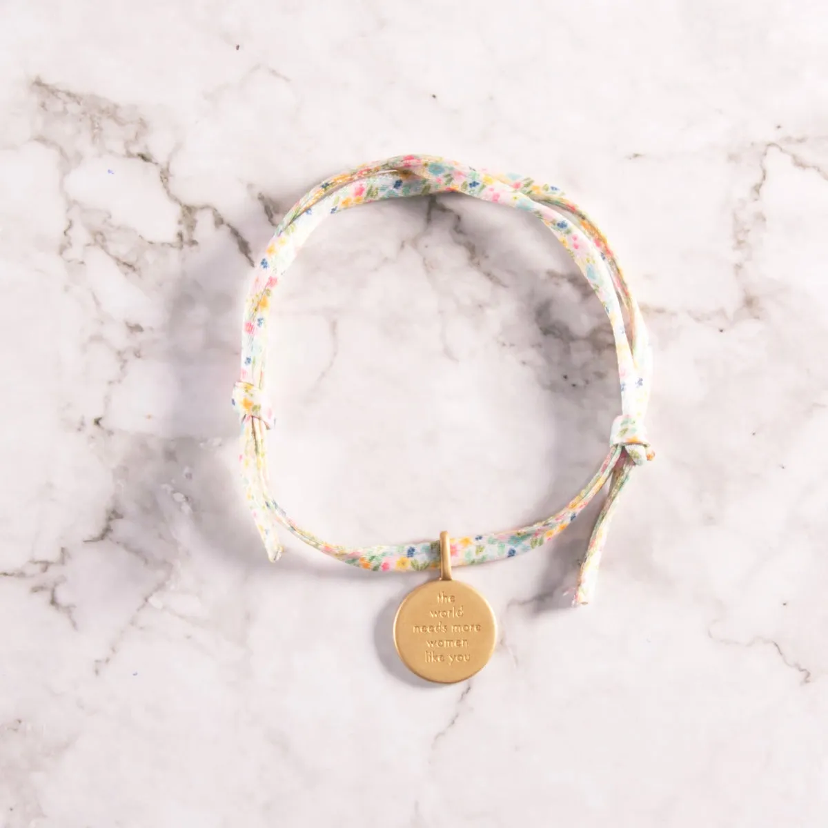 The World Needs More Women Like You Charm Tie Bracelet